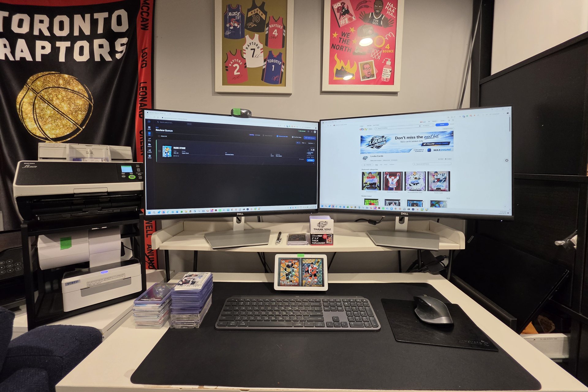 Christopher Loubert, founder of WaxEngine, at the scanning desk with a stack of hockey cards